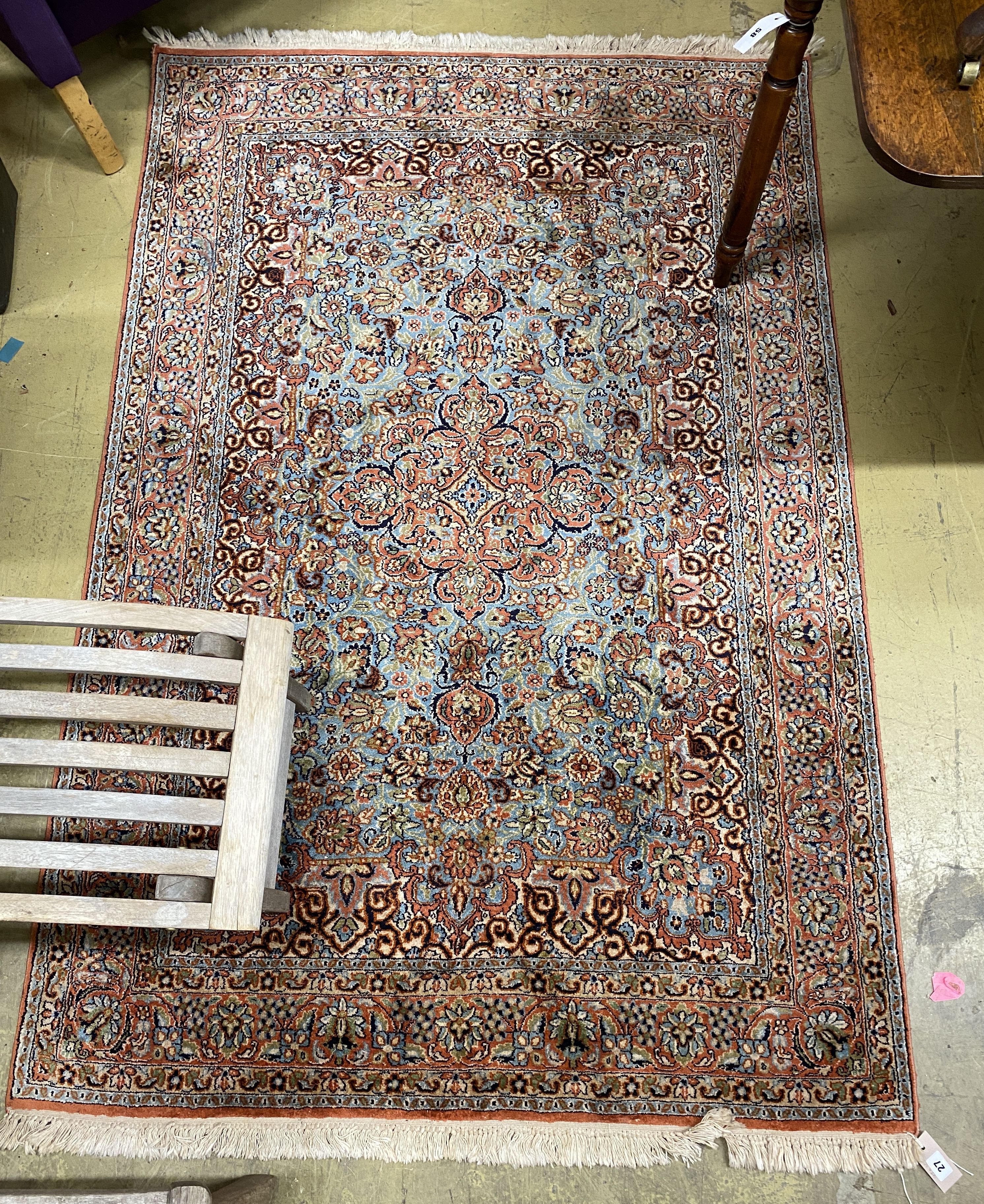 A Kashan style part silk blue ground rug, 185 x 123cm